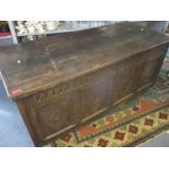 Circa 1650, an oak linenfold four panelled coffer on later castors