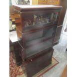 An early 20th century mahogany Globe Wernicke four tier bookcase with a drawer below 65 1/4" H x 34"