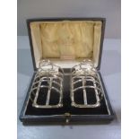 A pair of boxed small silver toast racks, dated Sheffield 1926