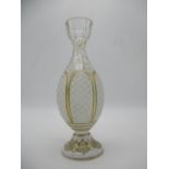 A 19th century Bohemian white overlaid, cut and gilded glass vase, decorated with six leaf shaped