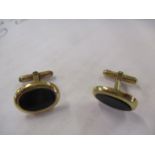 A pair of 9ct gold and black jet cufflinks, total weight 5.4g