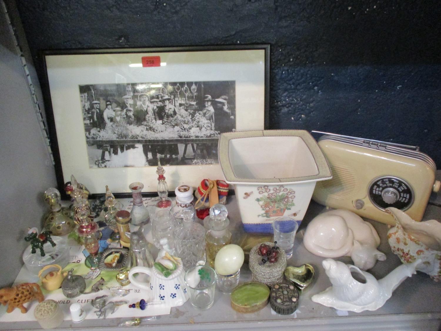 A miscellaneous lot to include a framed early 20th century photograph of a plant seller and mixed