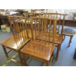 Four Chinese elm chairs with spindle back supports