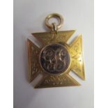 A 9ct yellow and rose gold sporting medal inscribed verso Junior Championships and dated 1906,