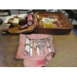 A vintage leather travelling case with ivory hair brushes and a mid 20th century gentleman's