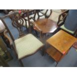 An early 20th century mahogany Chippendale style carver, together with a two tier yew wood table,