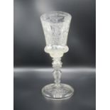 A late 19th century Bohemian engraved goblet, the bowl with basal swelling, all over wheel