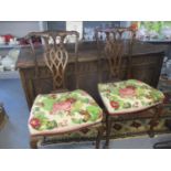 A pair of late Victorian/early Edwardian mahogany dining chairs with tapestry seats