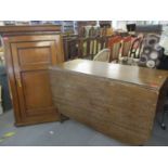 A 19th century mahogany drop leaf dining table and a string inlaid oak corner cabinet