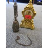 A reproduction Louis XV Swiss movement gilt mantle clock, 18cm high, together with a silver metal