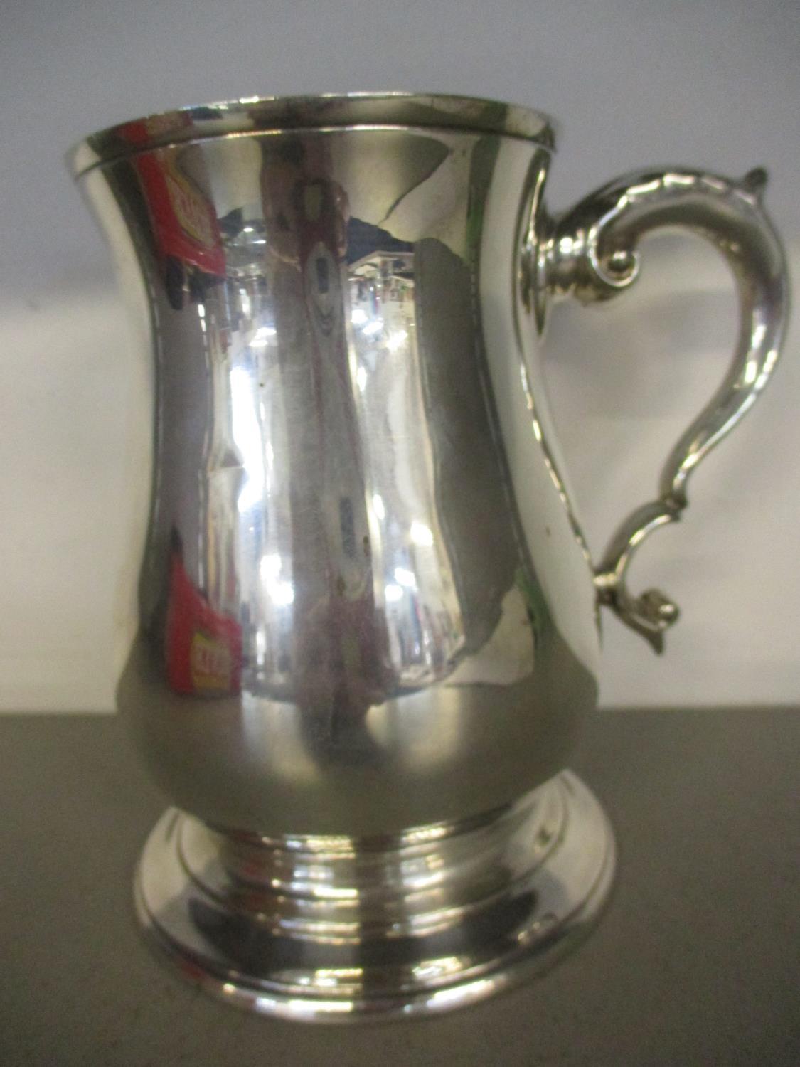 A Silver tankard, 323.7g