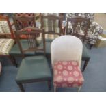 A set of four late 19th/early 20th century mahogany dining chairs and a low Lloyd Loom chair