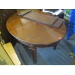 An early 20th century mahogany oval extending dining table with one extra leaf, 28 1/2"h x 58 3/4"