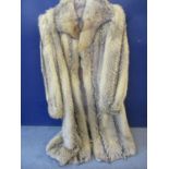Circa 1970 a wolf fur full length coat, measurements 42/44" chest x 47" long having a black clip