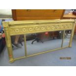 An early 19th century gilt over mantle wall hanging mirror 22 1/2 H x 48 3/4 W