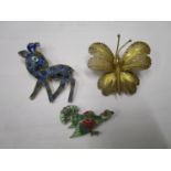 Three enamelled and silver gilt animal brooches to include an enamelled bird brooch set with