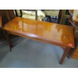 A reproduction yew coffee table 19" x 41" x 40"