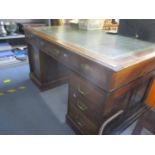 Circa 1900, a mahogany partner's desk with green leather scriber