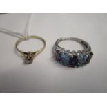 A 9ct white gold five stone ring set with alternating aquamarine and amethyst stones and a 9ct