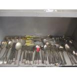 Mixed silver plated and other cutlery and flatware, together with four silver plated napkin rings