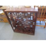 An Oriental rosewood floor standing display stand, 33" x 29" x 8"