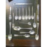 A mixed lot of silver cutlery to include spoons and a letter opener