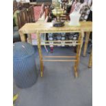 A modern bamboo clad console table, a Lloyd Loom linen basket and a beech towel rail and a brass