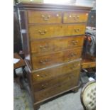 A George III mahogany chest on chest, having two short and six long drawers with swan neck handles