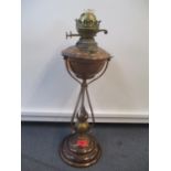Thermidor brass and copper Arts & Crafts oil lamp with a flower style column on domed foot