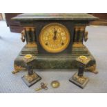 A late 19th century marble painted effect mantle clock and similar candlestick