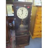 An early 20th century oak cased Gledhill Brook Time Recorder, clocking in clock, 45" h x 15 1/4"w