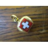 An 18ct yellow gold and enamelled Swiss charm in the form of a cow bell, 2.45g
