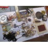 A mixed lot of mainly jewellery to include a silver fronted clock, a pearl necklace, a 1940s gents