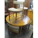 A 1970's retro teak extending dining table, together with six dining chairs, possibly by McIntosh