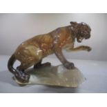 A Beswick ornament of a puma, numbered 1823 to the underside