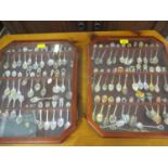 Two wall hanging display cases containing approximately 80 plus teaspoons from around the world