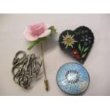 Four brooches to include a Norwegian silver example, an enamel and silver brooch
