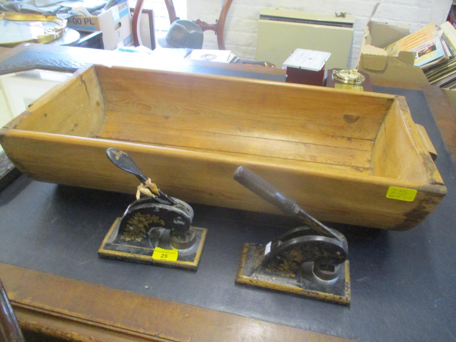 A pair of Victorian cast iron stamp presses, together with a pine trough