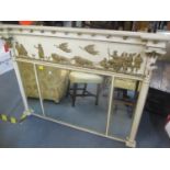 An early 20th century cream painted overmantle wall mirror having Corinthian columns and decorated