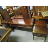 A mahogany stag dressing table with triptych mirror, a pair of matching bedside chests, and a four