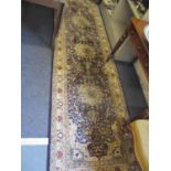 A Middle Eastern machine made woollen carpet having a navy ground with three large central motifs