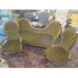A Victorian walnut carved salon sofa, together with a pair of matching spoon back armchairs
