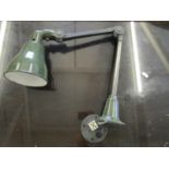 An early to mid 20th century engineering lamp with adjustable arm and green enamelled shade, un-
