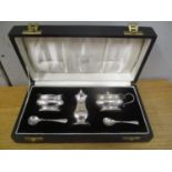 An early 20th century silver cased cruet set