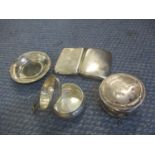 A small collection of silver items comprising a dish, cigarette case, a tea strainer and holder