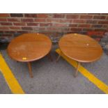 Two Ercol circular topped gateleg occasional tables with one drop side flap, label to underside, 16"