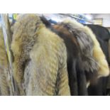 A 1970s wolf fur full length coat, a 20th century dark brown mink coat, two fur stoles