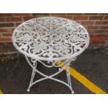 A garden wrought iron, white painted circular occasional table, 30" h x 27 1/4"w