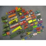 A quantity of mainly Dinky toy vehicles to include army vehicles, an SRN6 hovercraft, a UFO
