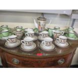 A Fathi Mahmoud Limoges Egyptian design teaset, and an Art Deco green and silver teaset